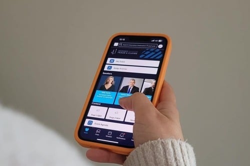 Photo of phone demoing insurance event networking app
