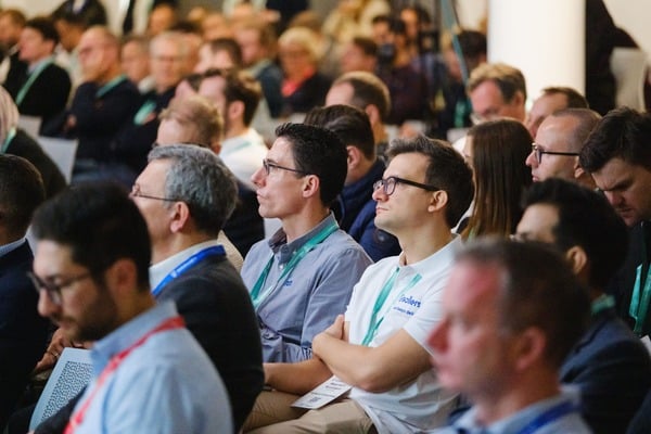 Attendees at insurance conference listening to talk