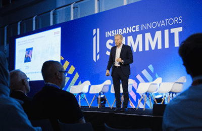 Insurance event speaker on stage