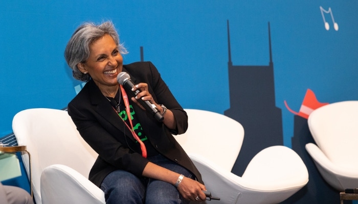 Insurance conference speaker on stage