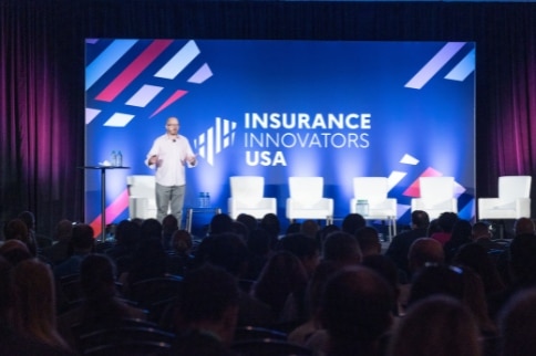 Insurance event speaker on stage